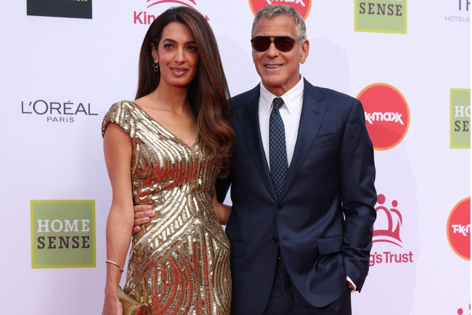 جورج كلوني George Clooney وأمل كلوني Amal Clooney في قاعة رويال ألبرت بلندن. مصدر الصورة: Adrian Dennis / AFP