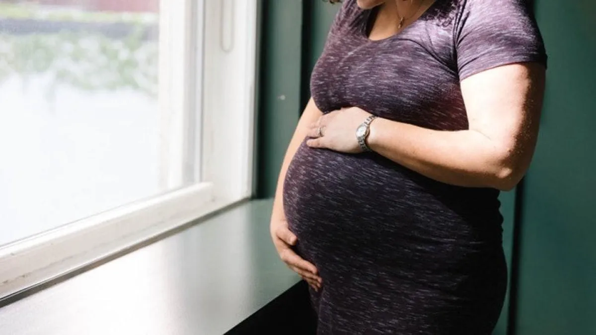 أعراض ألم المهبل الأولى أثناء الحمل، ألم في منطقة العجان وأسفل الظهر.