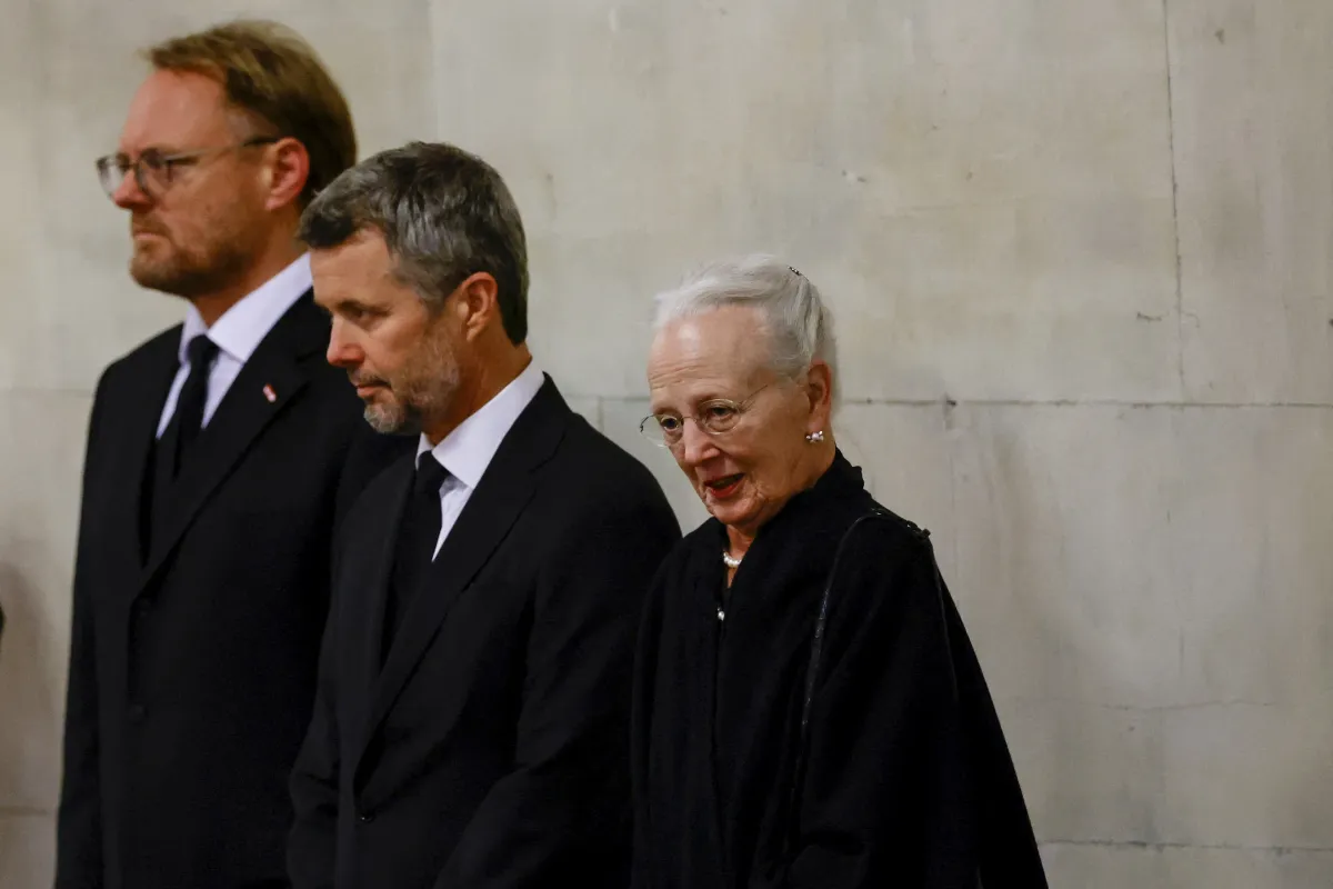 Queen Margrethe II of Denmark (R) and Crown Prince Frederik (C) pay their respects to the coffin of Queen Elizabeth II, Lying in State inside Westminster Hall, at the Palace of Westminster in London on September 18, 2022. Britain was gearing up Sunday for the momentous state funeral of Queen Elizabeth II as King Charles III prepared to host world leaders and as mourners queued for the final 24 hours left to view her coffin, lying in state in Westminster Hall at the Palace of Westminster. SARAH MEYSSONNIER /