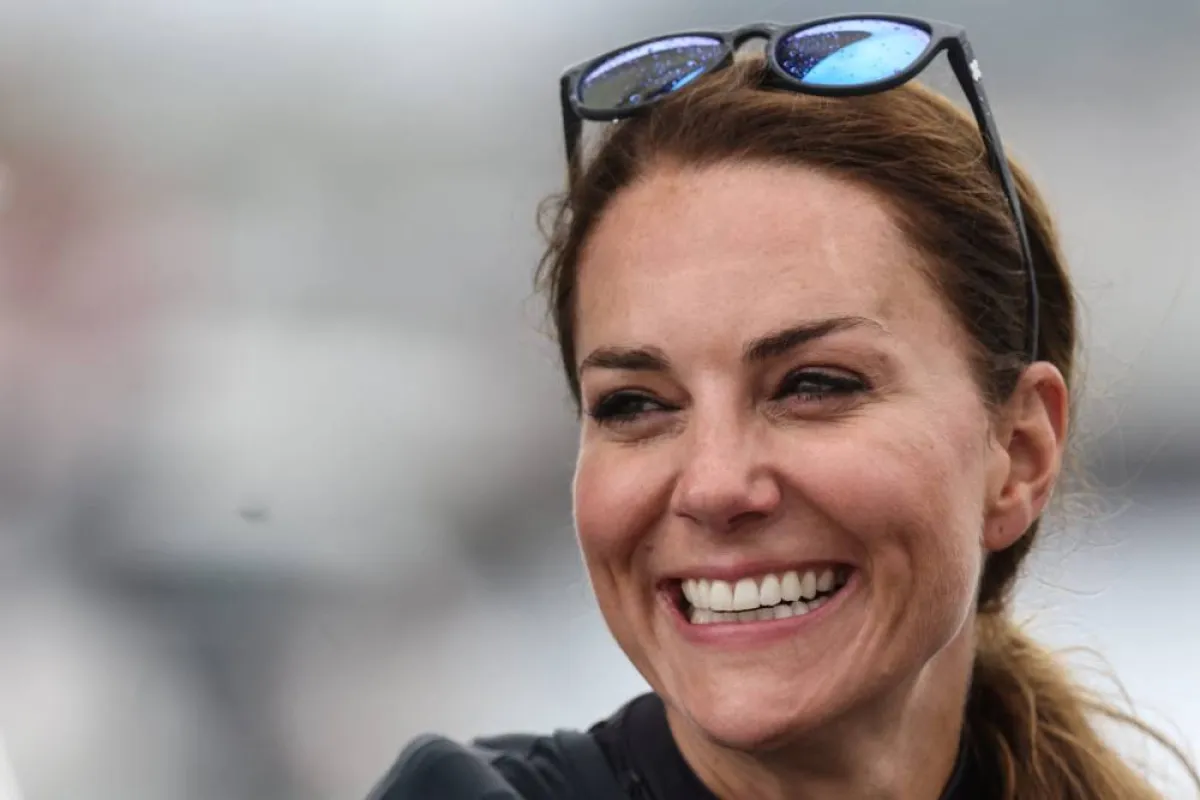 Britain's Catherine, Duchess of Cambridge, smiles as she joins the British team aboard of their F50 foiling catamaran to take part in a friendly "Commonwealth Race" against their New Zealand rivals, ahead of the final day of the Great Britain Sail Grand Prix, during a visit in Plymouth, on July 31, 2022. Jeff Gilbert / POOL / AFP