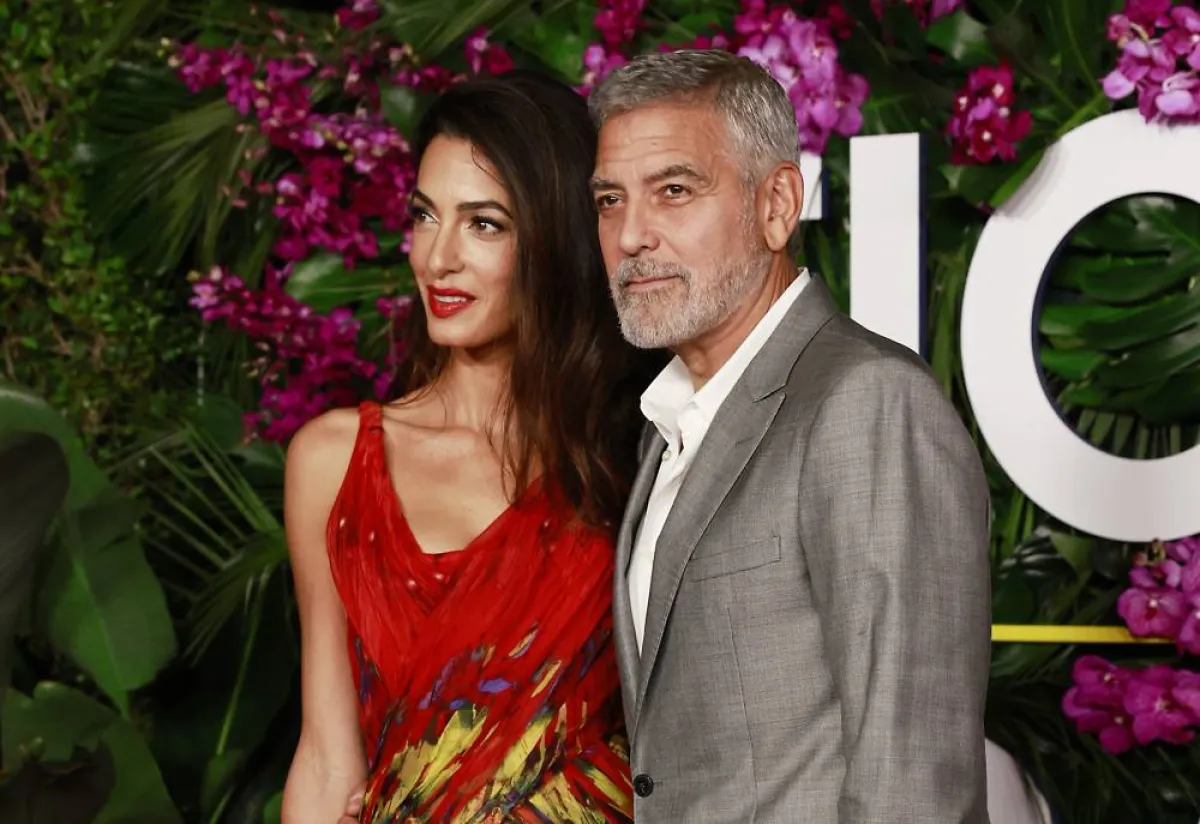 Lebanese-British barrister Amal Clooney (L) and US actor George Clooney arrive for the premiere of "Ticket to Paradise" at the Regency Village Theatre in Westwood, California, on October 17, 2022. Michael Tran / AFP