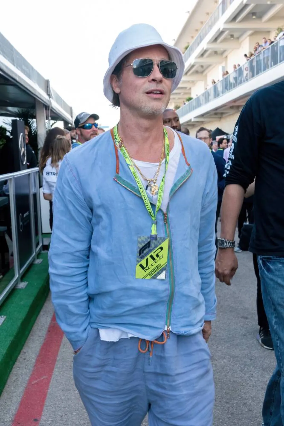 US actor Brad Pitt tours the paddock before the Formula One United States Grand Prix practice session at the Circuit of the Americas in Austin, Texas, on October 21, 2022.SUZANNE CORDEIRO / AFP