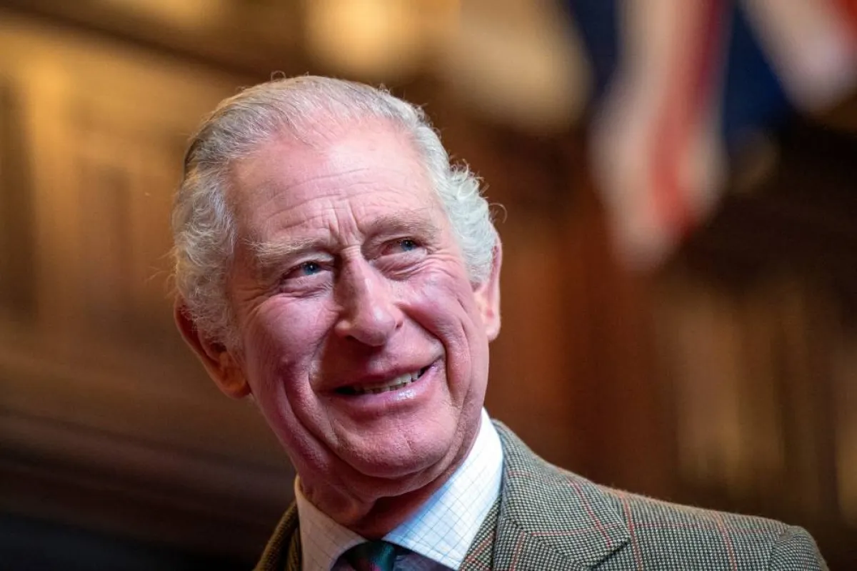 Britain's King Charles III reacts as he meets with families from Afghanistan, Syria and Ukraine who have settled in Aberdeen, during a visit to Aberdeen Town House, on October 17, 2022. Jane Barlow / POOL / AFP