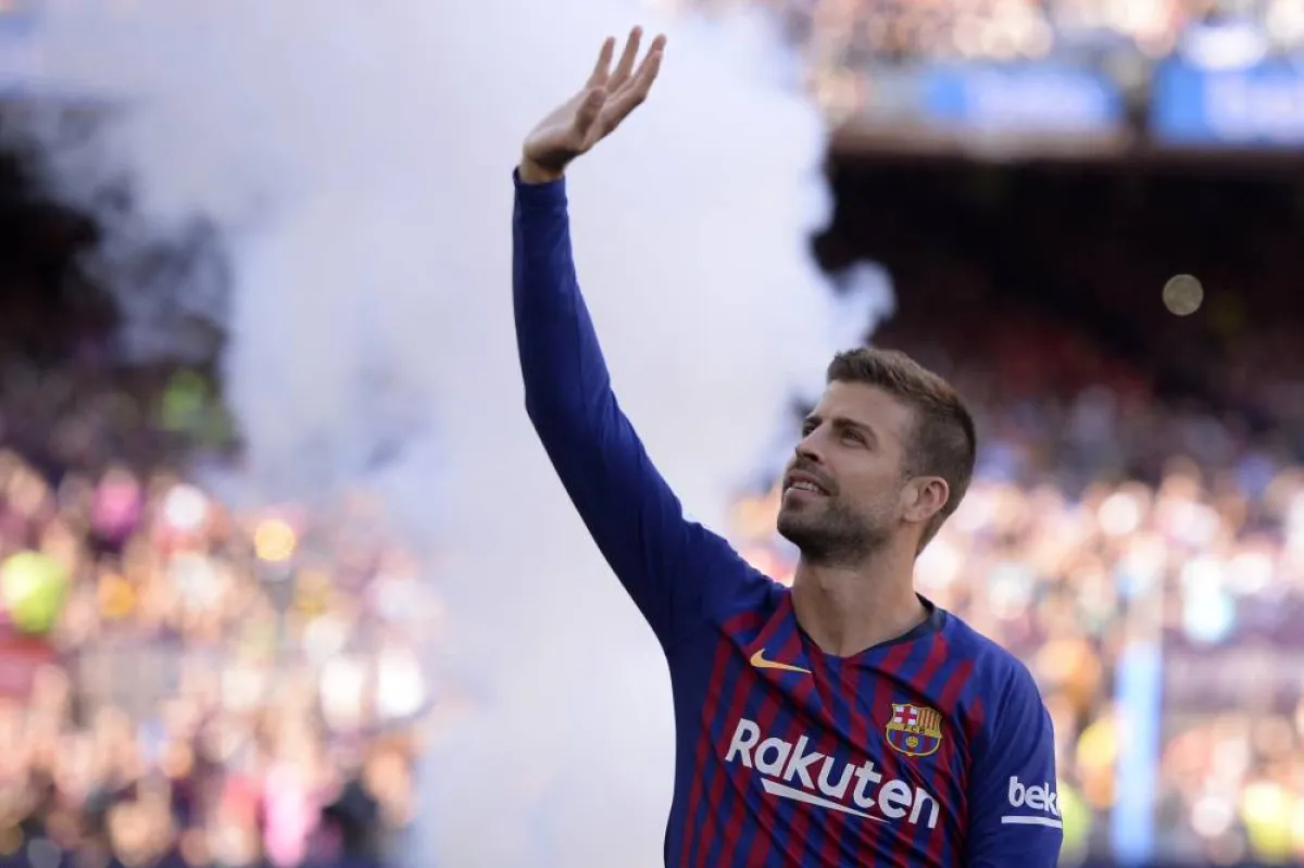 FILES) In this file photo taken on August 15, 2018 Barcelona's Spanish defender Gerard Pique waves at fans before the 53rd Joan Gamper Trophy friendly football match between Barcelona and Boca Juniors at the Camp Nou stadium in Barcelona. FC Barcelona's Gerard Pique has announced his retirement as footballer on Twitter, AFP reports on November 3, 2022. Josep LAGO / AFP