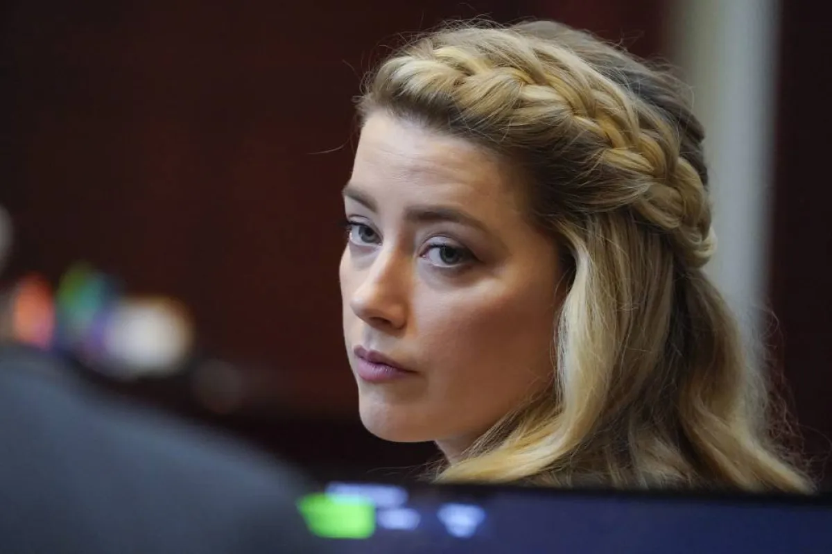 Actor Amber Heard arrives for closing arguments in the Depp v. Heard trial at the Fairfax County Circuit Courthouse in Fairfax, Virginia, on May 27, 2022. Actor Johnny Depp is suing ex-wife Amber Heard for libel after she wrote an op-ed piece in The Washington Post in 2018 referring to herself as a “public figure representing domestic abuse.” Steve Helber / POOL / AFP