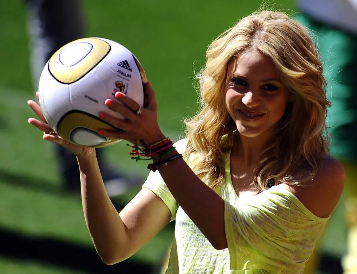 Colombia's singer Shakira, holding the Jo'bulani football that will be used for the final of the tournament, poses after a press conference on July 10, 2010 at Soccer City Stadium in Soweto, suburb of Johannesburg, on the eve of the 2010 Football World Cup final between The Netherlands and Spain. South Africa basked today in the success of its trouble-free World Cup, as finishing touches were put to the closing ceremony with superstar Shakira and a herd of giant elephant puppets. AFP PHOTO / STEPHANE DE SAK