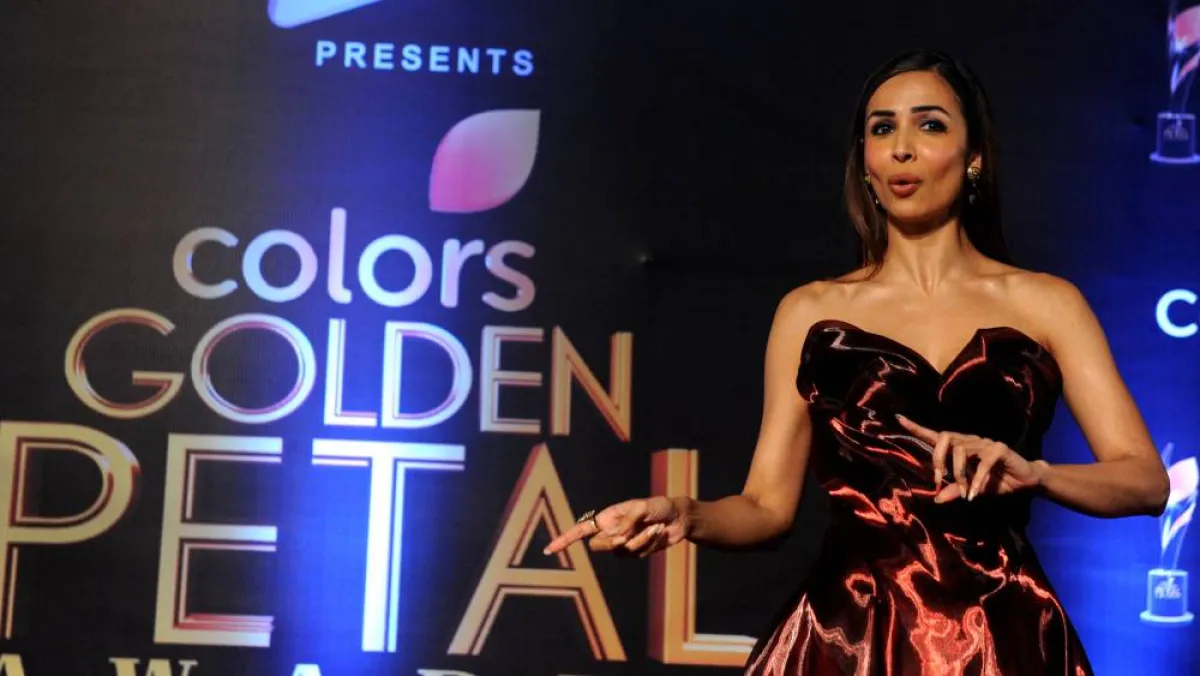 Indian Bollywood actress Malaika Arora poses as she attends the Colors ‘Golden Petal Awards’ ceremony in Mumbai late April 12, 2017.