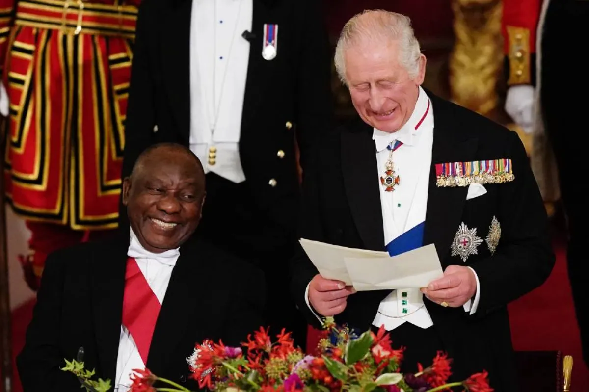 South Africa's President Cyril Ramaphosa listens as Britain's King Charles III speaks during a State Banquet at Buckingham Palace in London on November 22, 2022, at the start of the President's of South Africa's two-day state visit. King Charles III hosted his first state visit as monarch on Tuesday, welcoming South Africa's President to Buckingham Palace. Aaron Chown / POOL / AFP