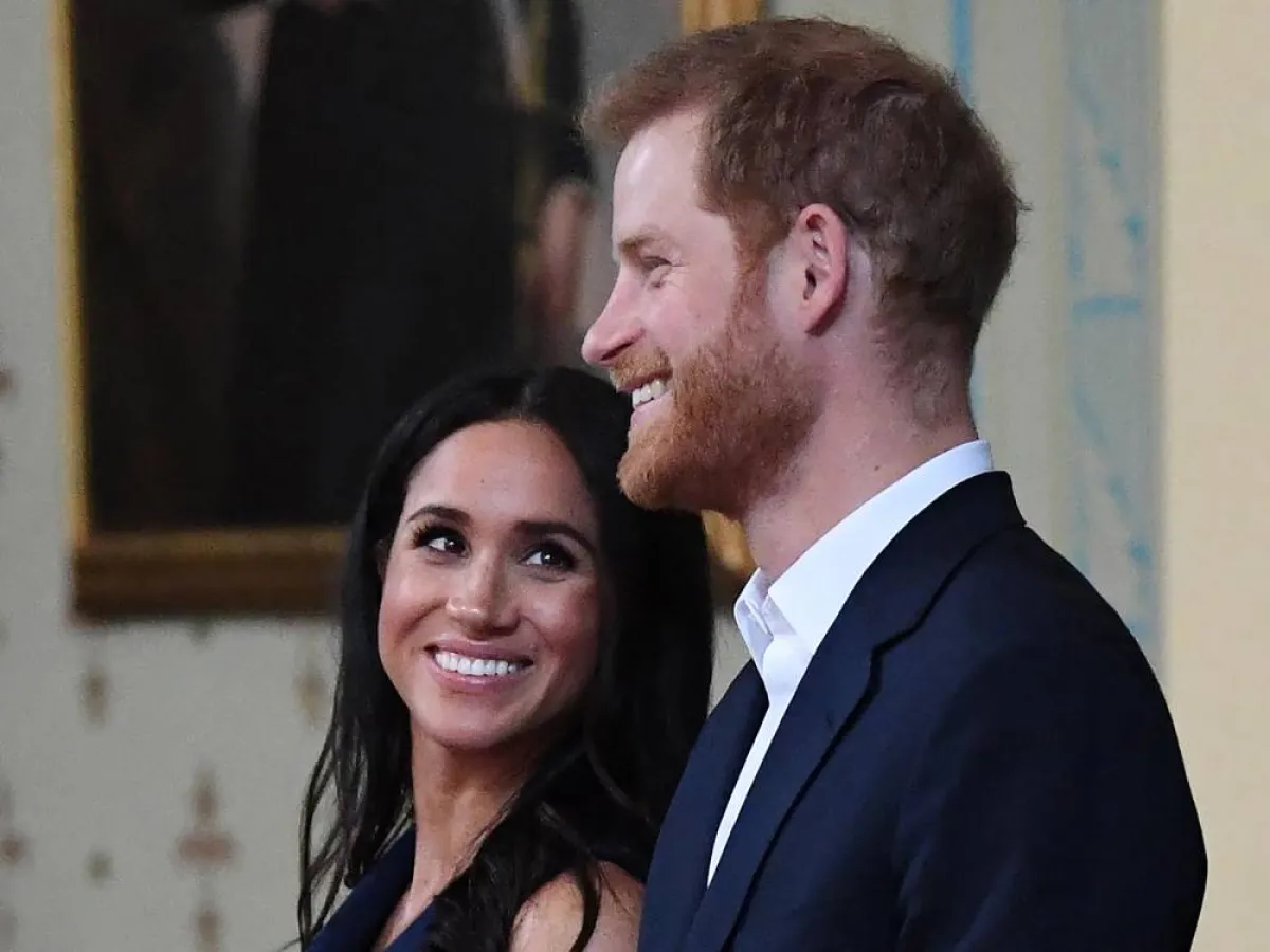 Britain's Prince Harry and Meghan, Duchess of Sussex attend a reception at Government House in Melbourne on October 18, 2018. Thousands of royal fans in Melbourne waited in the rain on October 18 to get a glimpse of Prince Harry and his pregnant wife Meghan, with some overwhelmed by the experience.JULIAN SMITH / POOL / AFP