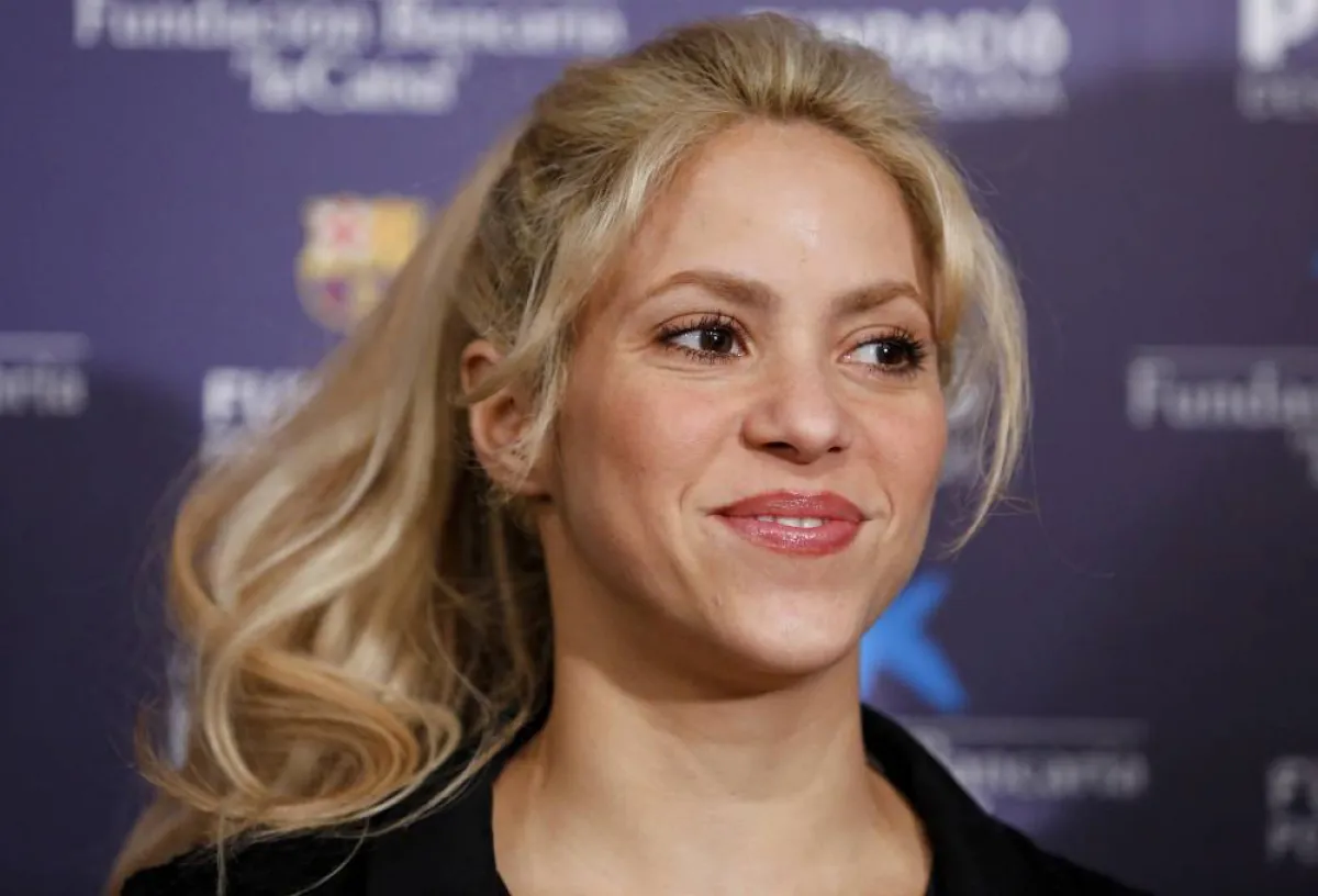 Colombian singer and founder of Colombian NGO, Fundacion Pies Descalzos, Shakira Mebarak, poses at the Camp Nou stadium in Barcelona on March 28, 2017 during the presentation of the project to build a new school in the restive region of Barranquilla (Colombia), in collaboration with the foundations of FC Barcelona and La Caixa. PAU BARRENA / AFP