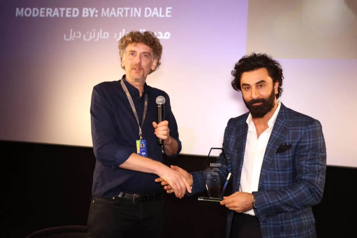 Martin Dale, who moderated an in coversation session with Indian actor Ranbir Kapoor (R), shakes hands with the Bollywood star on the 7th day of the Red Sea International Film Festival, in Jeddah, Saudi Arabia, on December 7, 2022. PATRICK BAZ / Red Sea Film Festival