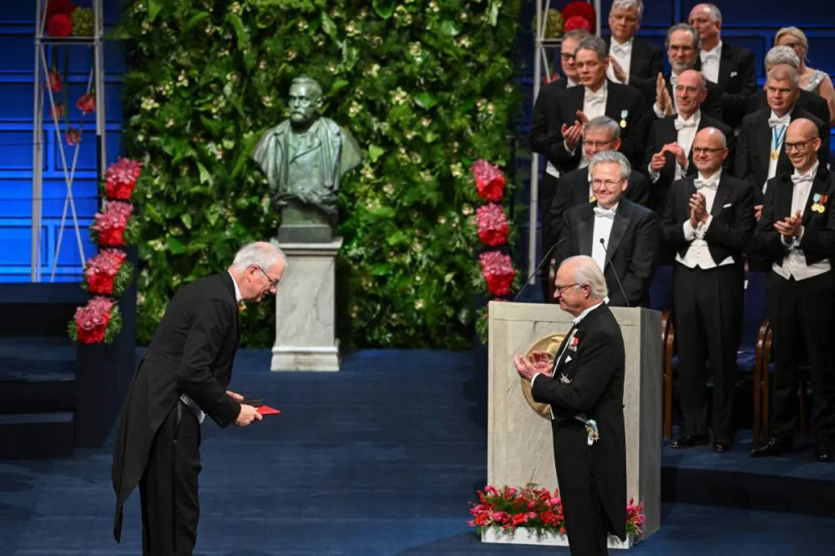 Danish chemist Morten Meldal (L) is awarded the Nobel Prize in Chemistry 2022 by King Carl XVI Gustaf of Sweden during the Nobel Prize award ceremony at the Concert Hall in Stockholm, Sweden on December 10, 2022. Jonathan NACKSTRAND / AFP