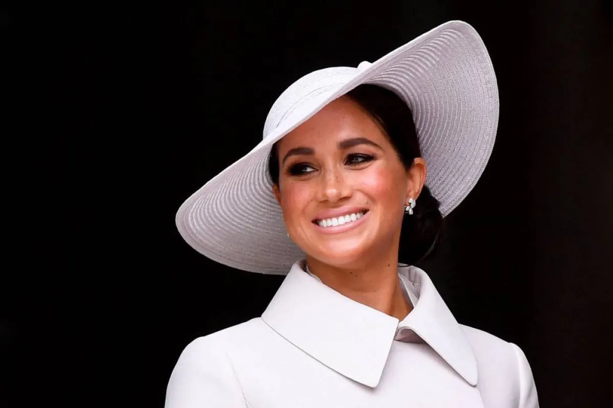 Britain's Meghan, Duchess of Sussex, smiles at the end of the National Service of Thanksgiving for The Queen's reign at Saint Paul's Cathedral in London on June 3, 2022 as part of Queen Elizabeth II's platinum jubilee celebrations. TOBY MELVILLE / POOL / AFP