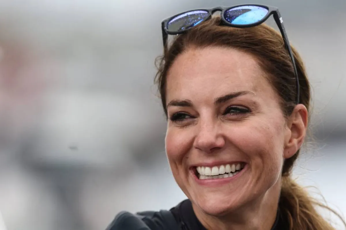 Britain's Catherine, Duchess of Cambridge, smiles as she joins the British team aboard of their F50 foiling catamaran to take part in a friendly "Commonwealth Race" against their New Zealand rivals, ahead of the final day of the Great Britain Sail Grand Prix, during a visit in Plymouth, on July 31, 2022. Jeff Gilbert / POOL / AFP
