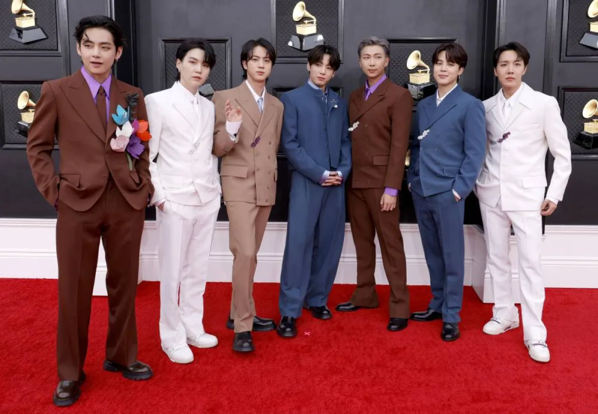 LAS VEGAS, NEVADA - APRIL 03: (L-R) V, Suga, Jin, Jungkook, RM, Jimin and J-Hope of BTS attend the 64th Annual GRAMMY Awards at MGM Grand Garden Arena on April 03, 2022 in Las Vegas, Nevada. Frazer Harrison/Getty Images for The Recording Academy/AFP Frazer Harrison / GETTY IMAGES NORTH AMERICA / Getty Images via AFP
