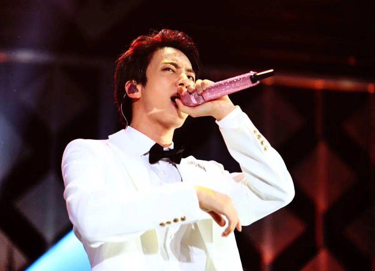 Jin of BTS performs onstage at the Forum on December 6, 2019 in Los Angeles, California. Rich Fury/Getty Images for iHeartMedia/AFP Rich Fury / GETTY IMAGES NORTH AMERICA / Getty Images via AFP