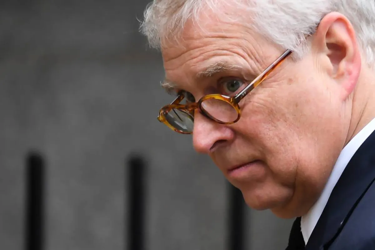 Britain's Prince Andrew, Duke of York looks at the flowers layed outside Balmoral Castle in Ballater, on September 10, 2022, ANDY BUCHANAN / AFP