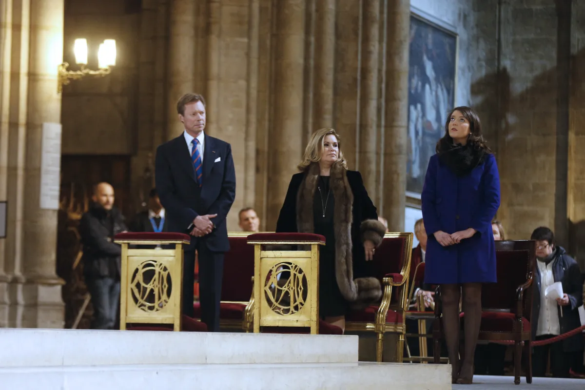 The Grand-Duke Henri of Luxembourg (L), his wife Grand-Duchess Maria Teresa (C), and their daughter Princess Alexandra (R) at Paris' Notre-Dame de Paris Cathedral on February 2, 2013 in Paris. AFP PHOTO / FRANCOIS GUILLOT FRANCOIS GUILLOT / AFP