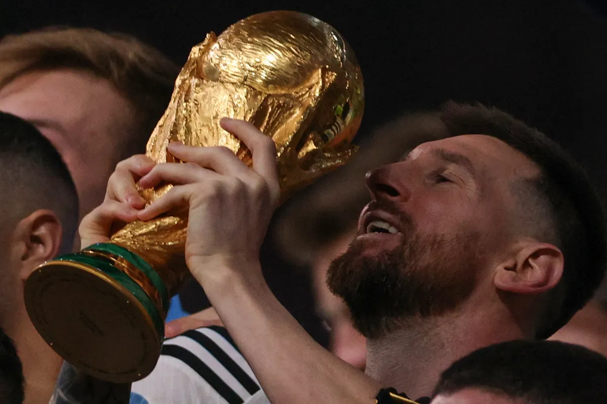  Lionel Messi lifts the FIFA World Cup Trophy during the trophy ceremony after Argentina won the Qatar 2022 World Cup final football match between Argentina and France at Lusail Stadium in Lusail, north of Doha on December 18, 2022. Adrian DENNIS / AFP