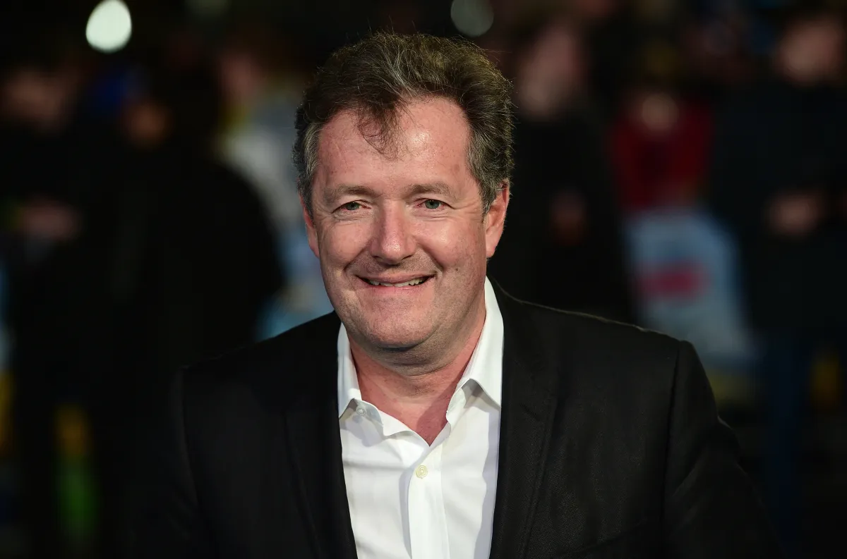 British journalist and television personality Piers Morgan poses for a photograph as he arrives for the European premiere of Eddie The Eagle in London on March 17, 2016. LEON NEAL / AFP