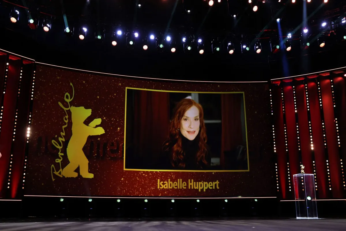 isabelle Huppert is seen on a screen as she takes part per video call in the Honorary Golden Bear ceremony prior the premiere of the film 'A propos de Joan (About Joan)' in the Berlinale Speciale Gala section of the 72nd Berlinale Film Festival in Berlin on February 15, 2022. Ronny HARTMANN / AFP
