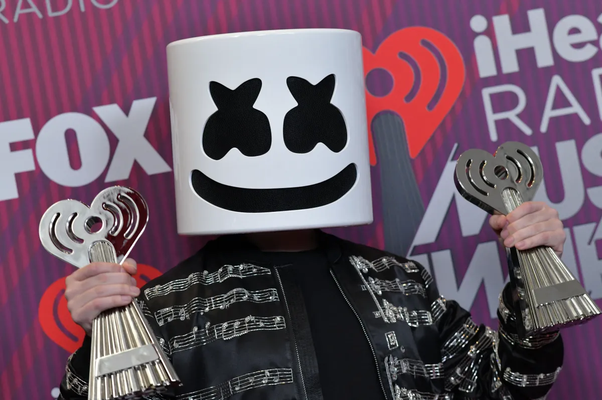 Best New Pop Artist and Dance Artist of the Year winner Marshmello poses in the press with his awards during the 2019 iHeart Radio Music Awards at the Microsoft theatre on March 14, 2019 in Los Angeles. Chris Delmas / AFP
