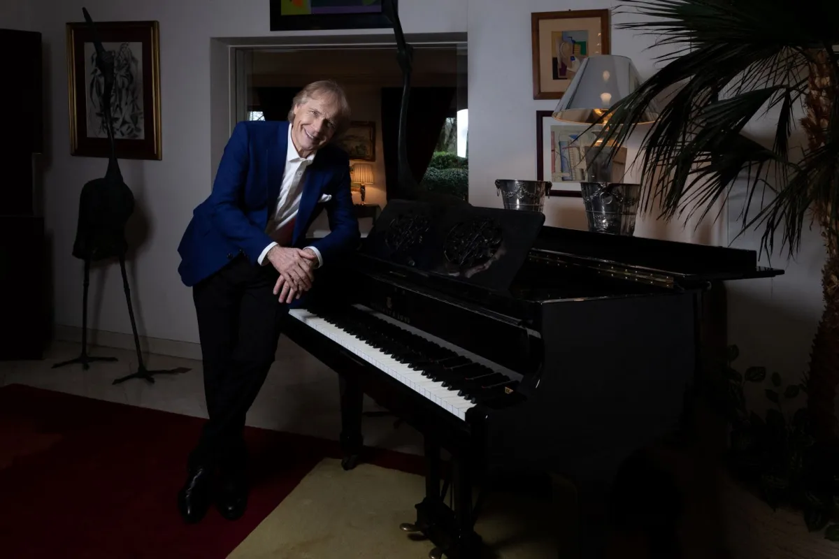 French pianist Richard Clayderman poses during a photo session in Neuilly-sur-Seine, near Paris, on January 28, 2022. JOEL SAGET / AFP