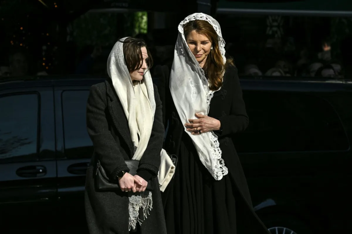 Queen Noor al-Hussein of Jordan (R) arrives with her daughter Princess Raiyah for the funeral service of former King of Greece Constantine II in the Metropolitan Cathedral of Athens, on January 16, 2023. Louisa GOULIAMAKI / AFP