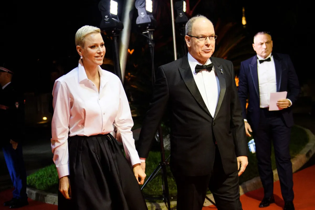 Princess Charlene of Monaco and Prince Albert II of Monaco arrive on the red carpet before the 2022 World Rugby Awards ceremony in Monaco on November 20, 2022. CLEMENT MAHOUDEAU / AFP