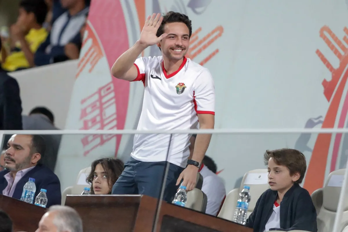 Jordan's Crown Prince Hussein greets the fans during the Group B FIFA World Cup 2022 and the 2023 AFC Asian Cup qualifying football match between Jordan and Australia in the Jordanian capital Amman on November 14, 2019. Ahmad ALAMEEN / AFP