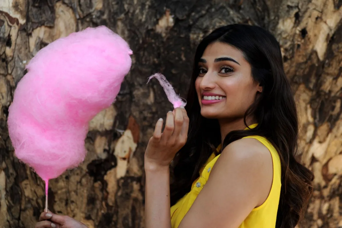 Indian Bollywood actress Athiya Shetty unveils a creation by designer Nishka Lulla in Mumbai on March 22, 2016. AFP