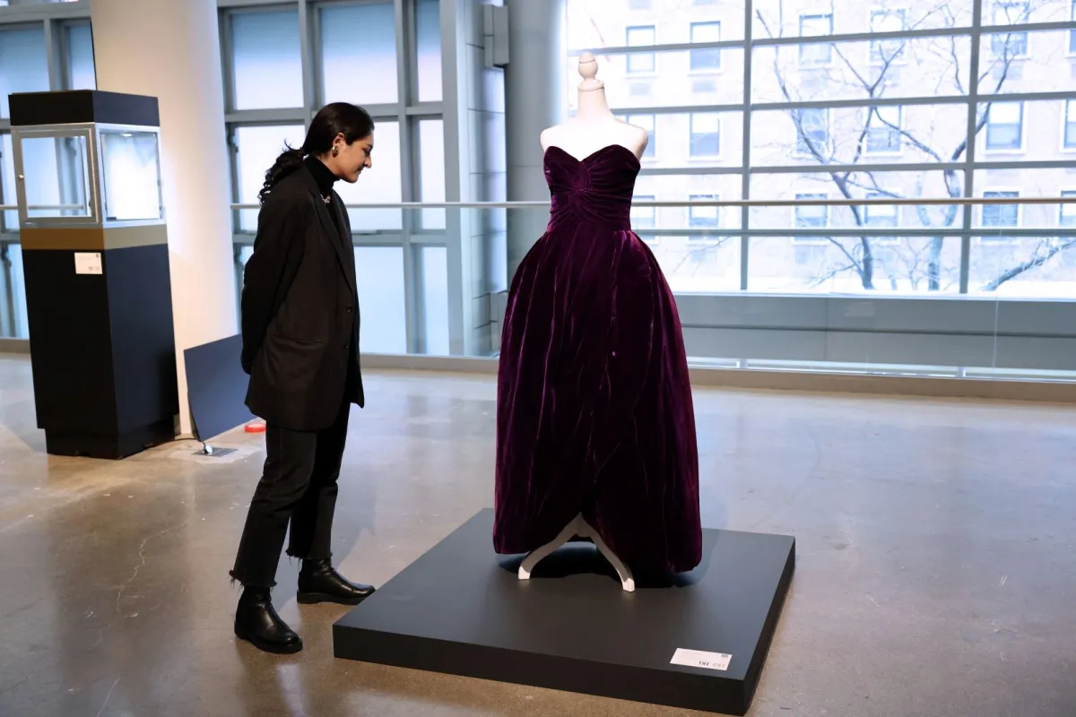 A person looks at Princess Diana's ball dress by Victor Edelstein during The One press preview at Sotheby's New York on January 20, 2023 in New York. Cindy Ord/Getty Images/AFP Cindy Ord / GETTY IMAGES NORTH AMERICA / Getty Images via AFP