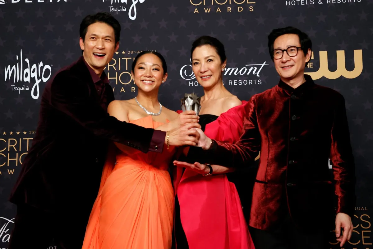 (L-R) Actors Harry Shum Jr., Stephanie Hsu, Michelle Yeoh and Ke Huy Quan pose in the press room with the award for Best Picture for "Everything Everywhere All at Once" during the 28th Annual Critics Choice Awards at the Fairmont Century Plaza Hotel in Los Angeles, California on January 15, 2023. Michael TRAN / AFP