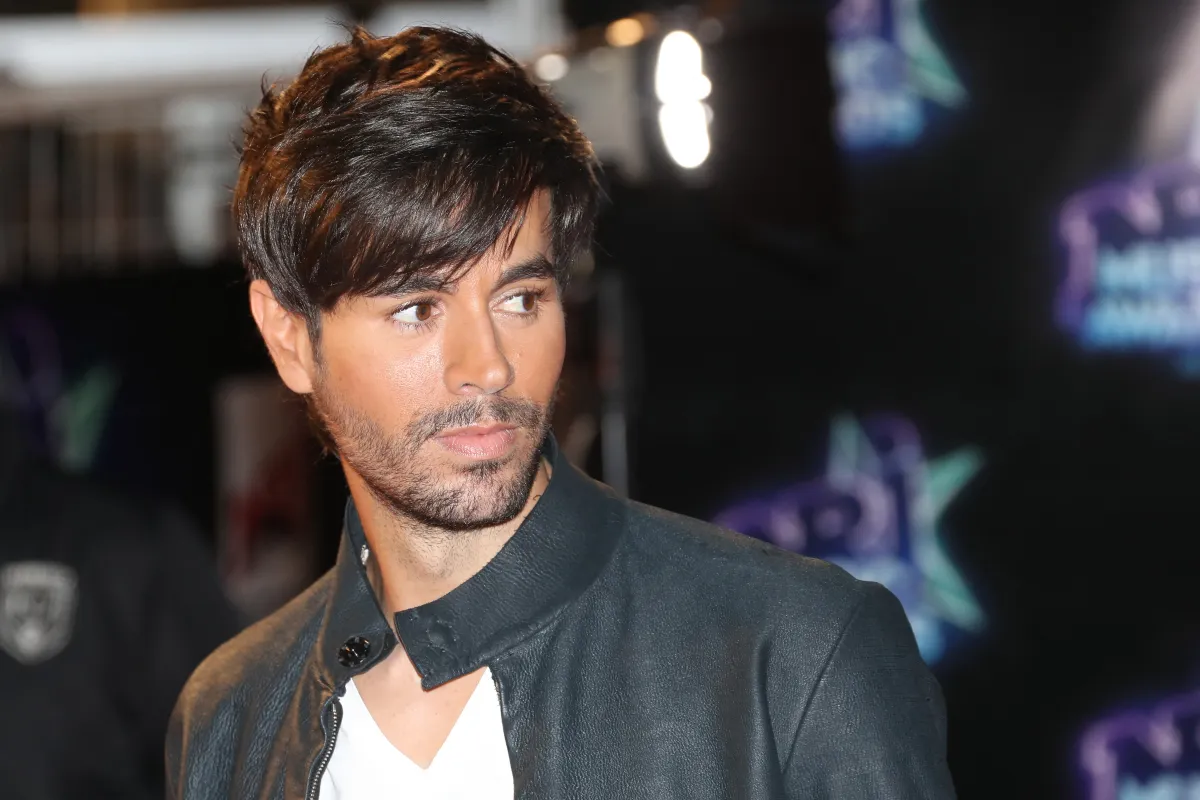 Spanish singer Enrique Iglesias poses upon his arrival at the Palais des Festivals to attend the 18th Annual NRJ Music Awards on November 12, 2016 in Cannes, southeastern France. VALERY HACHE / AFP