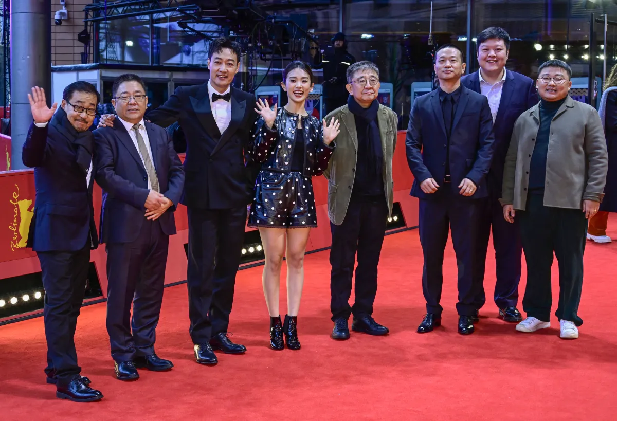 Actor Wang Hongwei (L), director Zhang Lu (4thR), actress Huang Yao (4thL), Chinese actor Xin Baiqing (3rdL) and other members of the film team pose on the red carpet for the film "The Shadowless Tower" in competition at the Berlinale, Europe's first major film festival of the year, on February 18, 2023 in Berlin. John MACDOUGALL / AFP