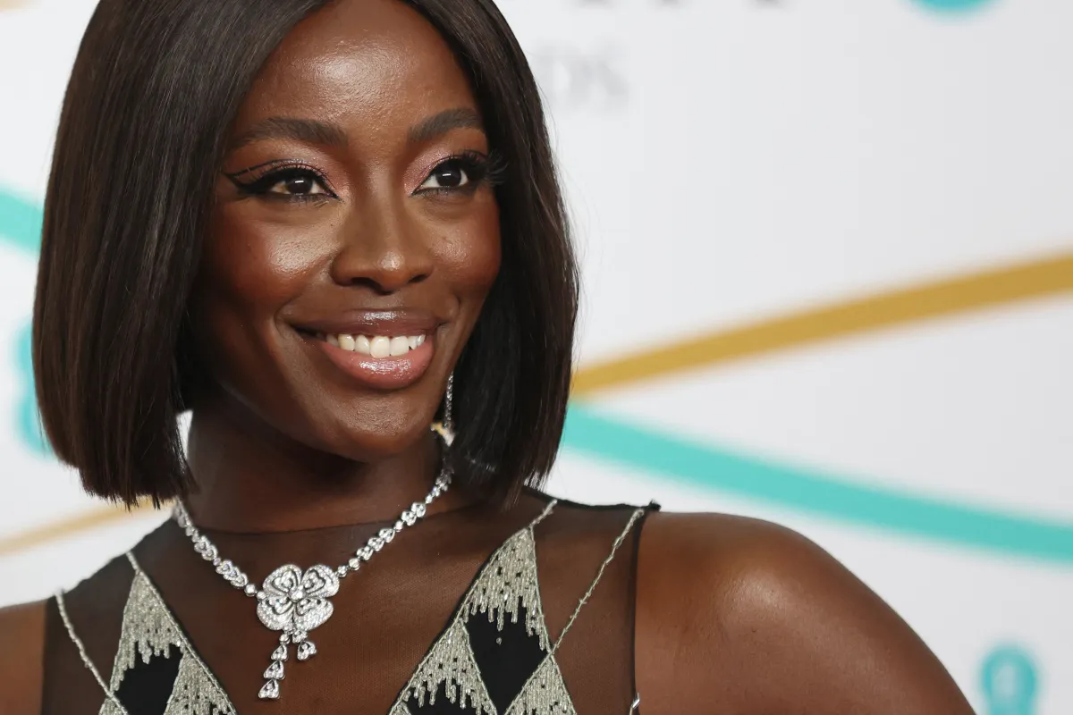 TV host AJ Odudu poses on the red carpet upon arrival at the BAFTA British Academy Film Awards at the Royal Festival Hall, Southbank Centrer, in London, on February 19, 2023. ISABEL INFANTES / AFP