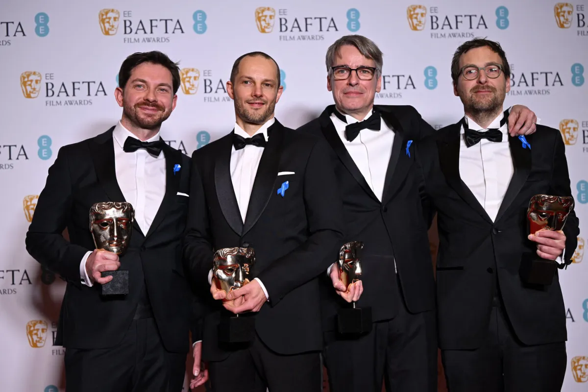 Viktor Prasil, Markus Stemler, Frank Kruse and Lars Ginzel pose with their awards for 'All Quiet on the Western Front' during the BAFTA British Academy Film Awards ceremony at the Royal Festival Hall, Southbank Centre, in London, on February 19, 2023. JUSTIN TALLIS / AFP