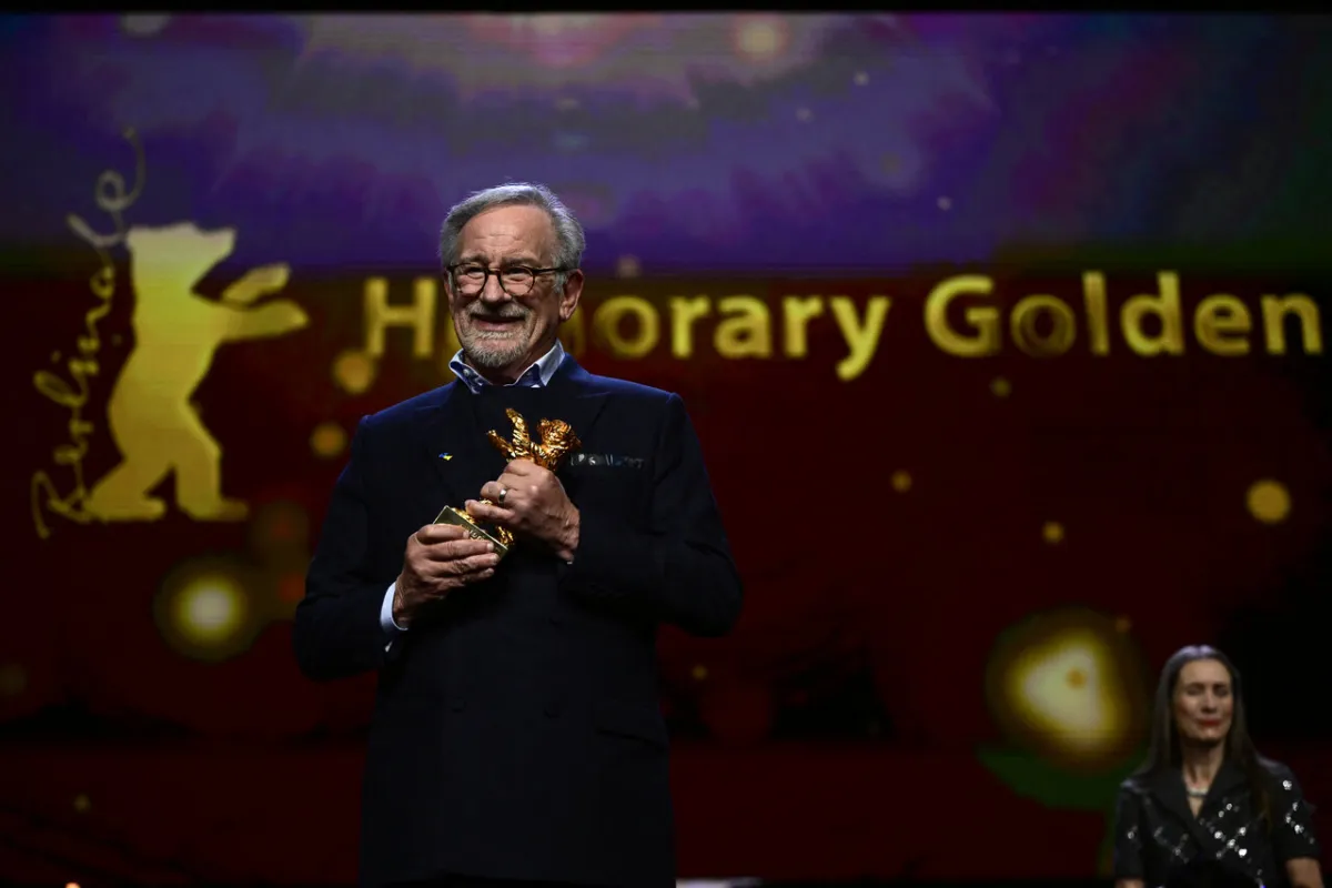 Steven Spielberg poses with the "Honorary Golden Bear" for lifetime achievement during the Honorary Golden Bear ceremony and the premiere of his film 'The Fabelmans', presented as 'Homage' at the Berlinale, Europe's first major film festival of the year, on February 21, 2023 in Berlin. John MACDOUGALL / AFP