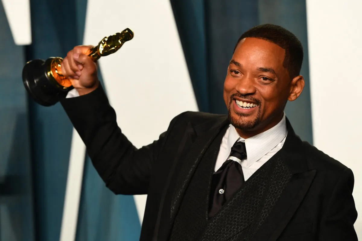 Will Smith holds his award for Best Actor in a Leading Role for "King Richard" as he attends the 2022 Vanity Fair Oscar Party following the 94th Oscars at the The Wallis Annenberg Center for the Performing Arts in Beverly Hills, California on March 27, 2022. Patrick T. FALLON / AFP