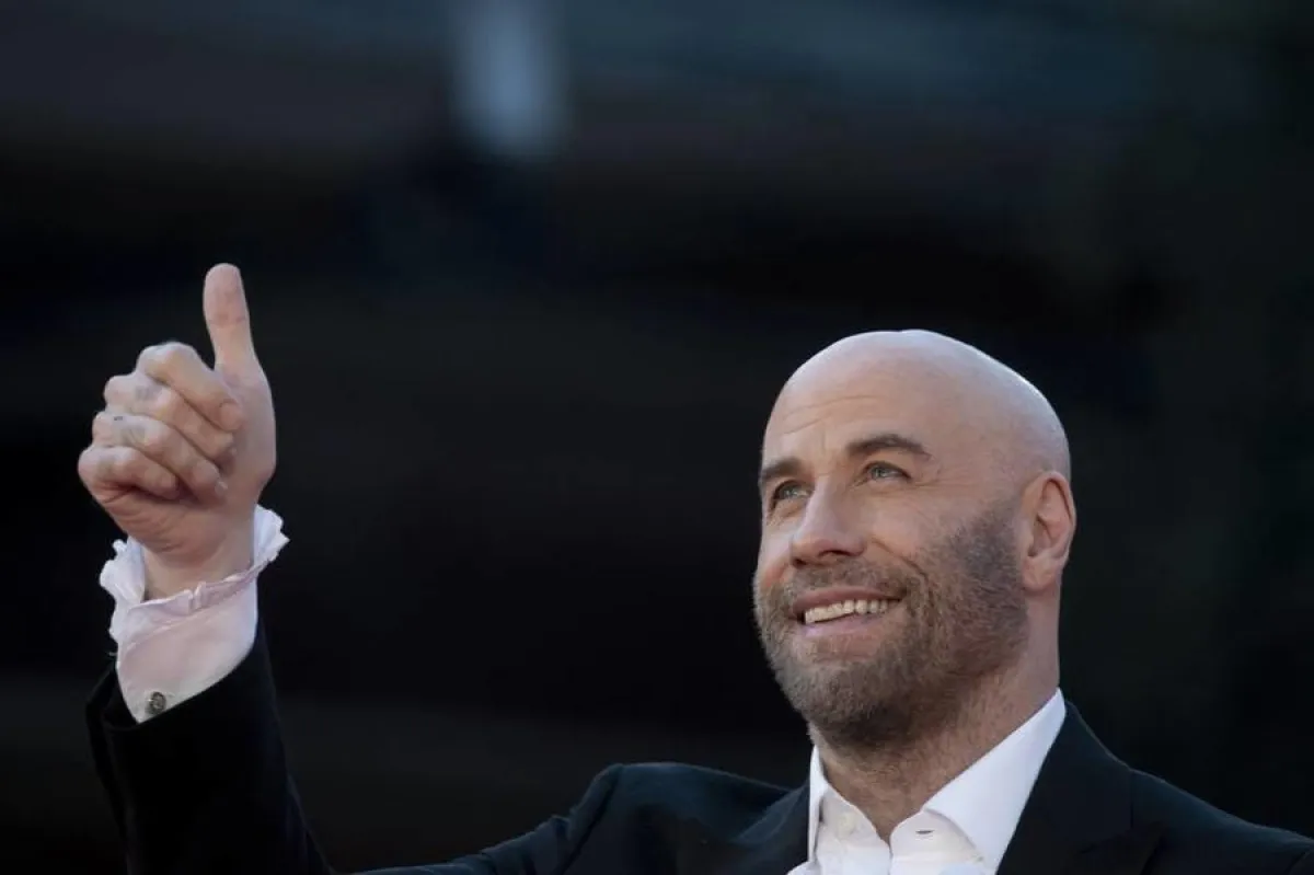US actor John Travolta gestures as he arrives for a tribute screening on October 22, 2019 during the 14th Rome Film Festival (Festa del Cinema di Roma) at the Auditorium Parco della Musica in Rome. Tiziana FABI / AFP