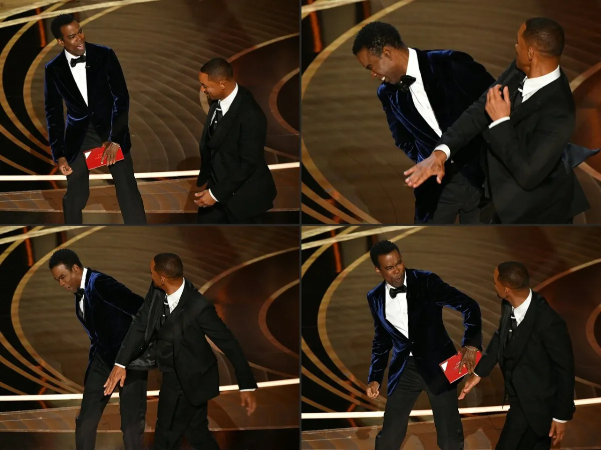 Will Smith (R) slaps US actor Chris Rock onstage, during the 94th Oscars at the Dolby Theatre in Hollywood, California on March 27, 2022.Robyn Beck / AFP