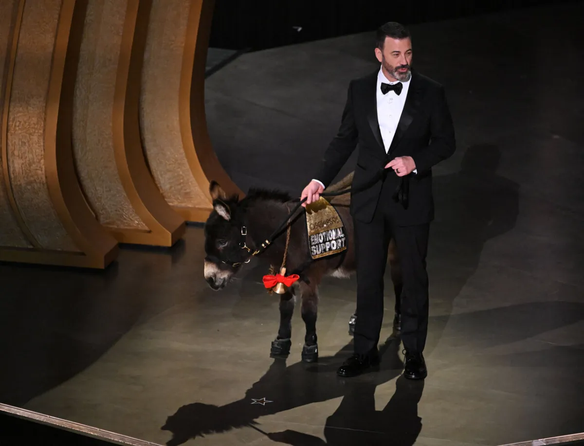 Jimmy Kimmel walks onstage with a donkey during the 95th Annual Academy Awards at the Dolby Theatre in Hollywood, California on March 12, 2023. Patrick T. Fallon / AFP