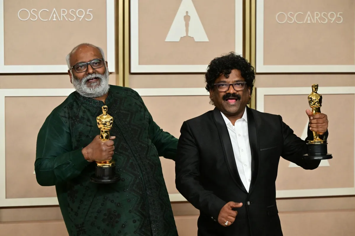 M.M. Keeravaani (L) and Chanrabose (R) at the Dolby Theatre in Hollywood, California on March 12, 2023. Frederic J. Brown / AFP