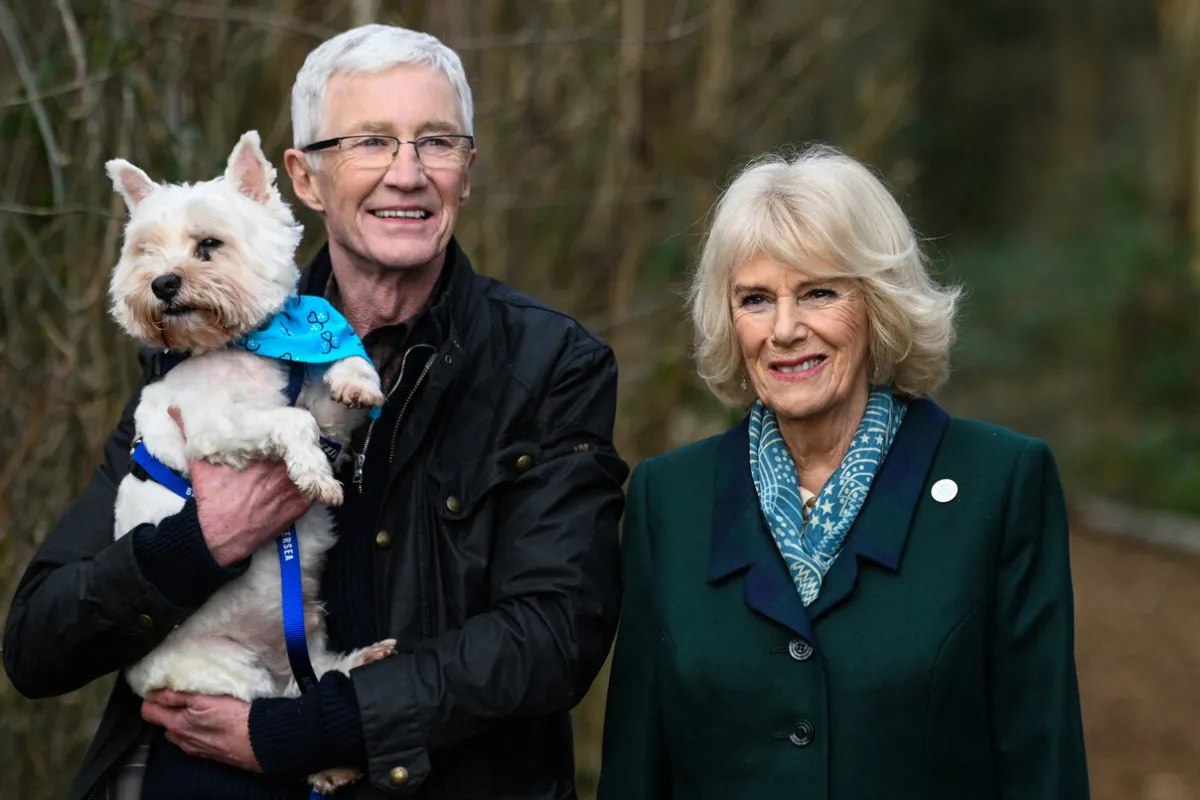 Britain's Camilla, Duchess of Cornwall (R) poses with Battersea Ambassador, Paul O’Grady during her visit to Battersea Brand Hatch Centre on February 2, 2022 in Ash as part of a visit in Kent. Stuart C. Wilson / POOL / AFP