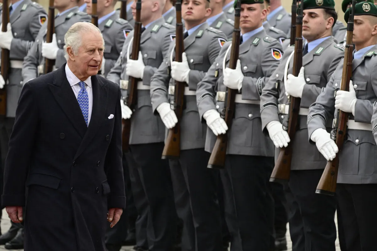 King Charles III reviews an honor guard as he attends a ceremonial welcome at Brandenburg Gate in Berlin, on March 29, 2023. John MACDOUGALL / AFP