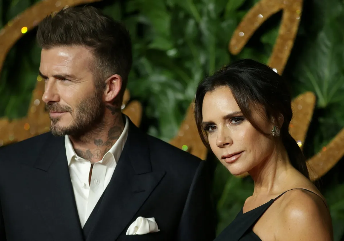 David Beckham (L) and his wife Victoria Beckham pose on the red carpet upon arrival to attend the British Fashion Awards 2018 in London on December 10, 2018Daniel LEAL / AFP