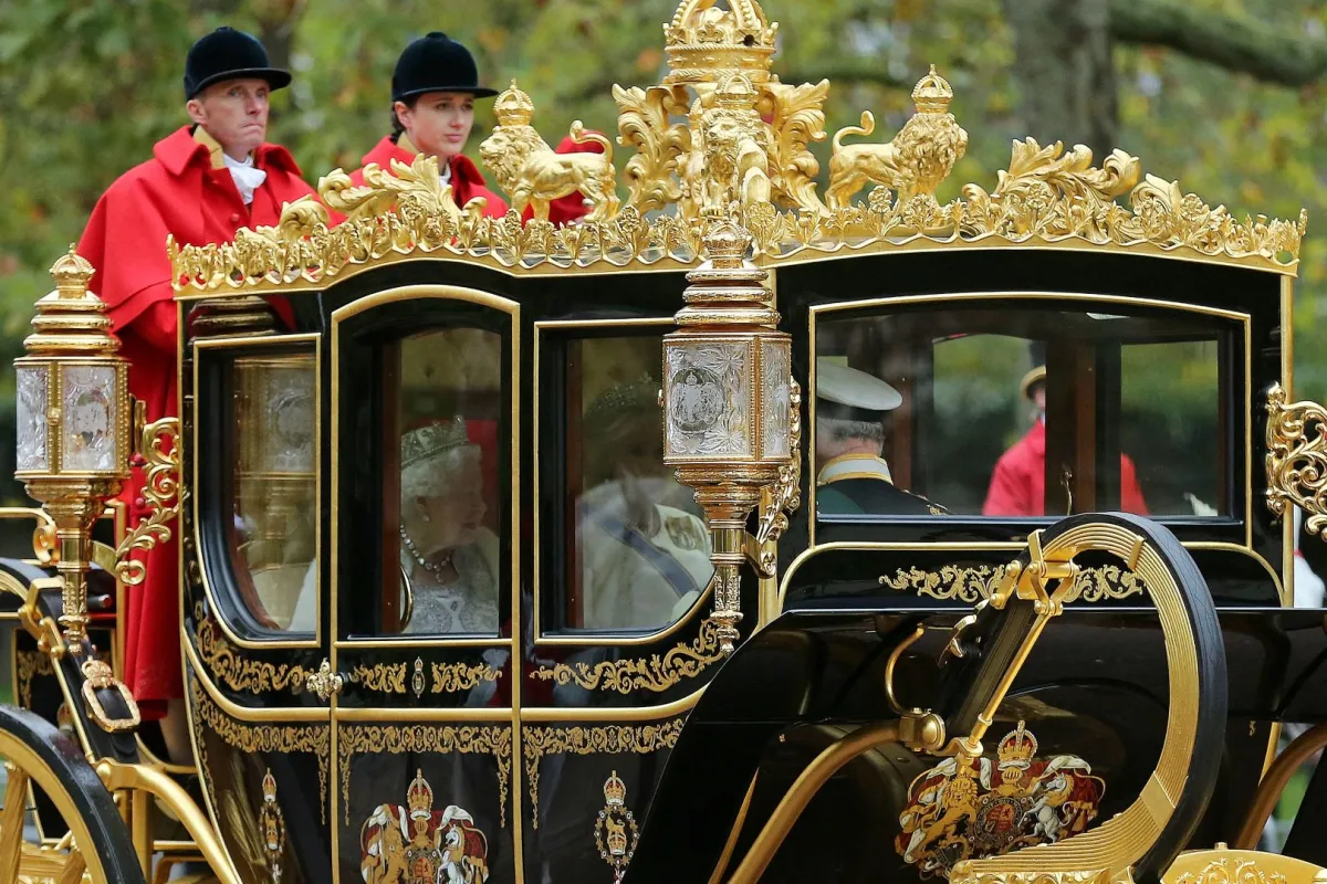 Queen Elizabeth II rides with her son Prince Charles in the Diamond Jubilee State Coach on the Mall in London on October 14, 2019. ISABEL INFANTES / AFP