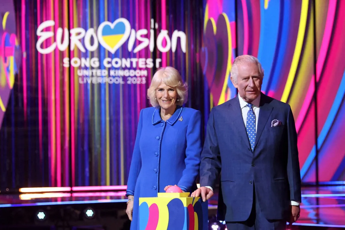 King Charles III and Britain's Camilla, Queen Consort switch on the stage lighting as they visit the host venue of this year's Eurovision Song Contest, the M&S Bank Arena in Liverpool, on April 26, 2023. PHIL NOBLE / POOL / AFP