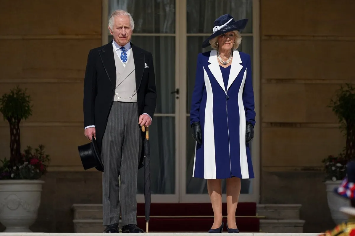 King Charles III and Britain's Camilla, Queen Consort arrive to meet the guests attending the Garden Party at Buckingham Palace, in London, on May 3, 2023 to celebrate their coronation ceremony as King and Queen of the United Kingdom and Commonwealth Realm nations, on May 6, 2023. Yui Mok / POOL / AFP