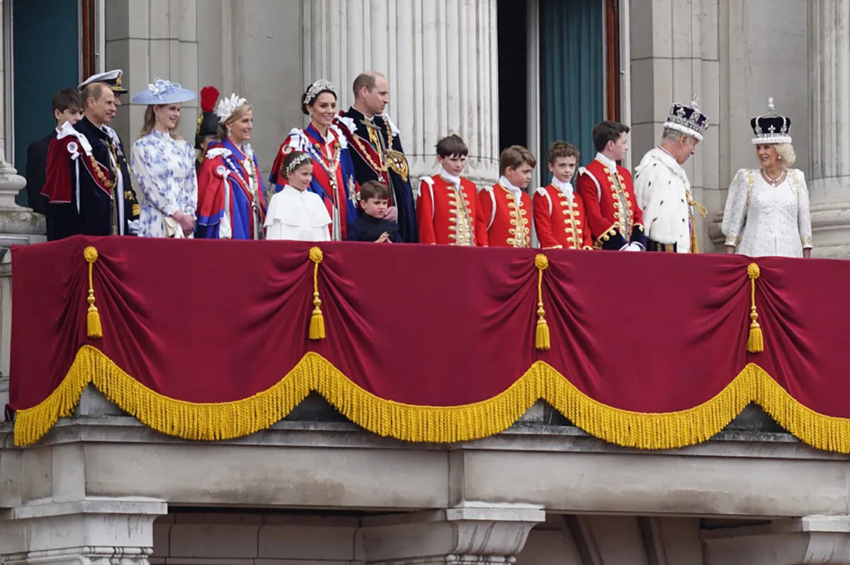 Britain's King Charles III and Britain's Queen Camilla and other members of the Royal Family look on from the Buckingham Palace balcony while viewing the Royal Air Force fly-past in central London on May 6, 2023, after their coronations.  James Manning / POOL / AFP